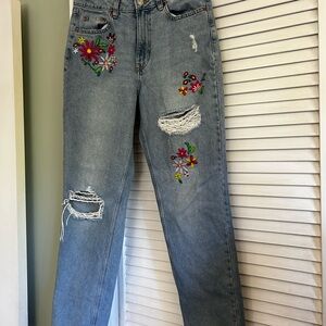 Very cute distressed jeans, with flowers.